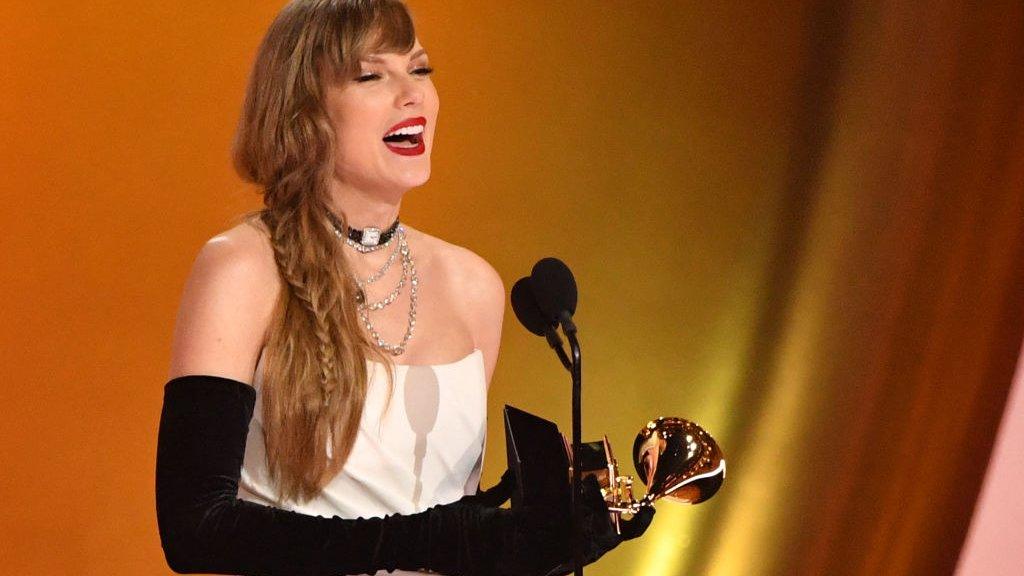 Taylor Swift accepting her Grammy in February 2024.