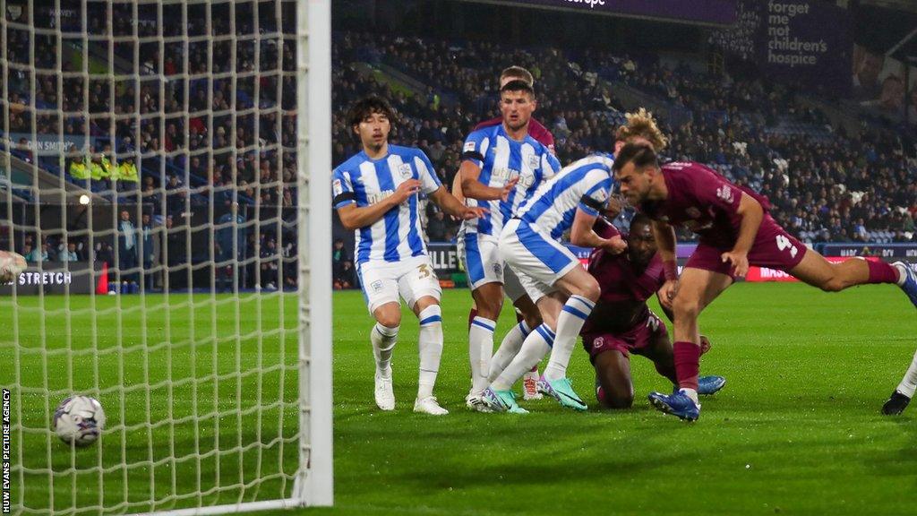 Dimitrios Goutas heads in the second goal