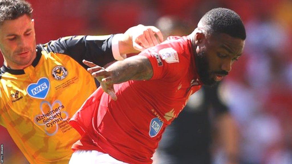 Yann Songo'o was part of the Morecambe side who beat Michael Flynn's Newport in the League Two play-off final at Wembley in 2021 in May 2021