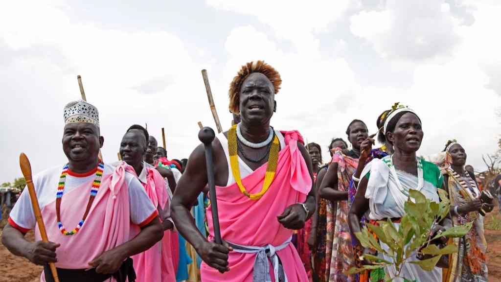 South Sudanese refugees perform a traditional dance as the United Nations High Commissioner for Refugees visits the newly created Pagirinya refugee settlement in Adjumani, north of the capital Kampala on August 29, 2016