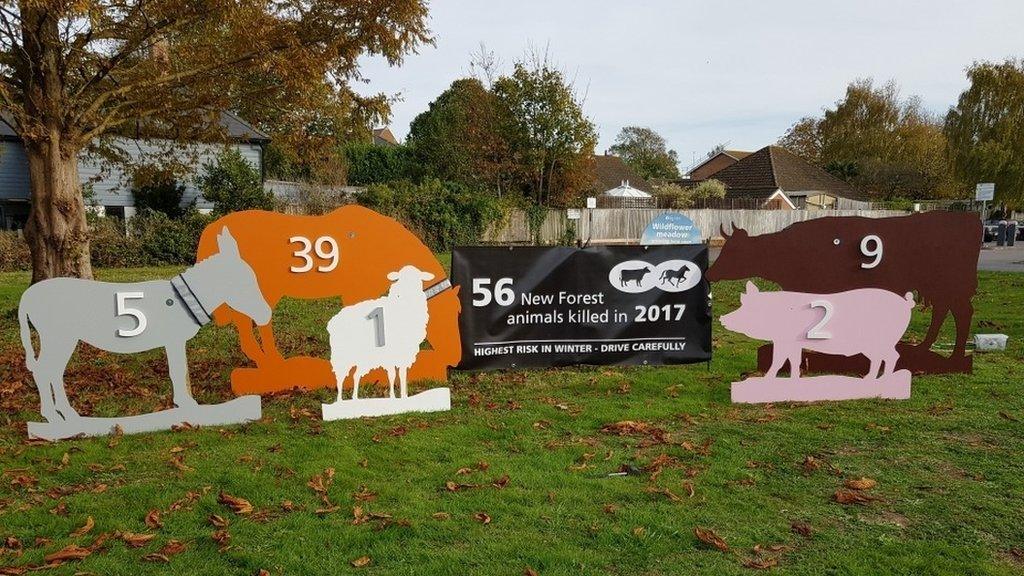 The animal silhouette signs being placed around the New Forest