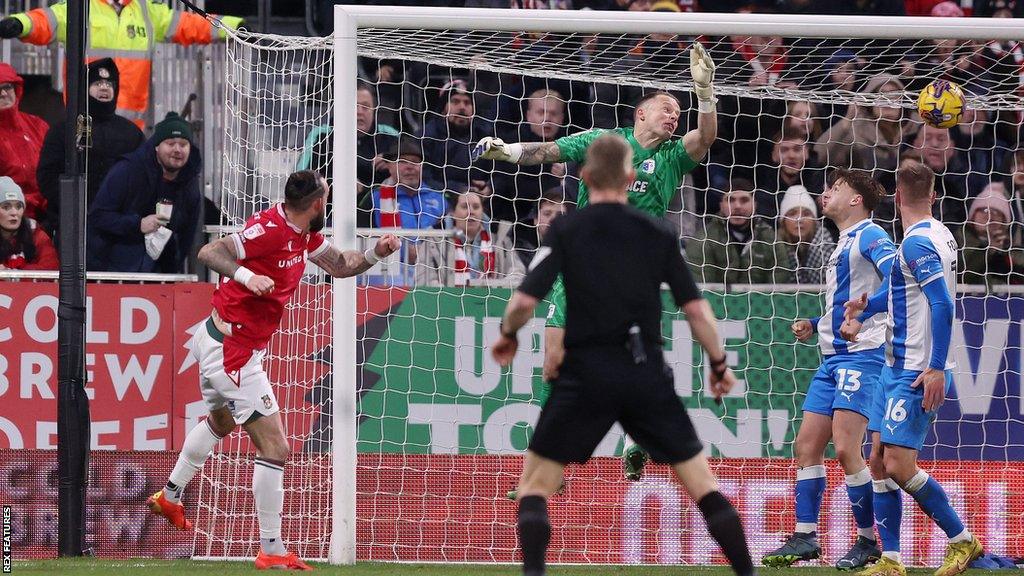 Steven Fletcher's back-post header from a corner gave Wrexham a 3-1 lead over Barrow at half-time