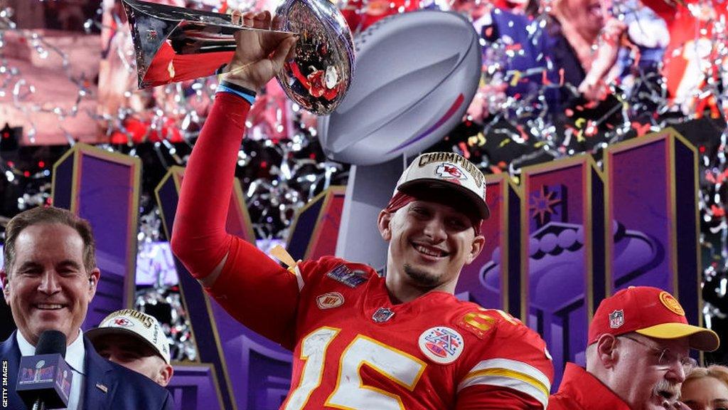 Patrick Mahomes lifts the Super Bowl trophy