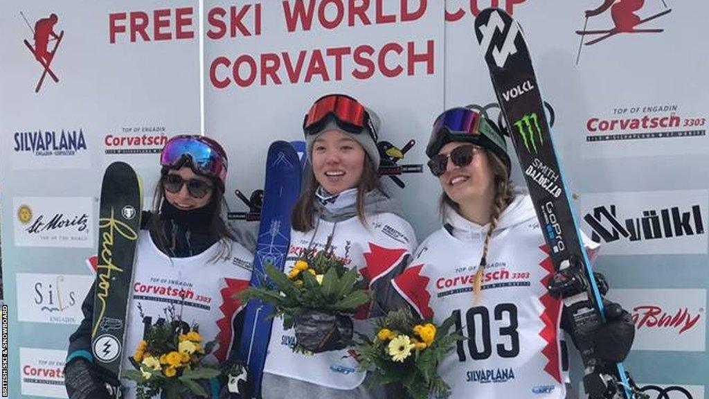 Izzy Atkin, centre, on the podium at Silvaplana