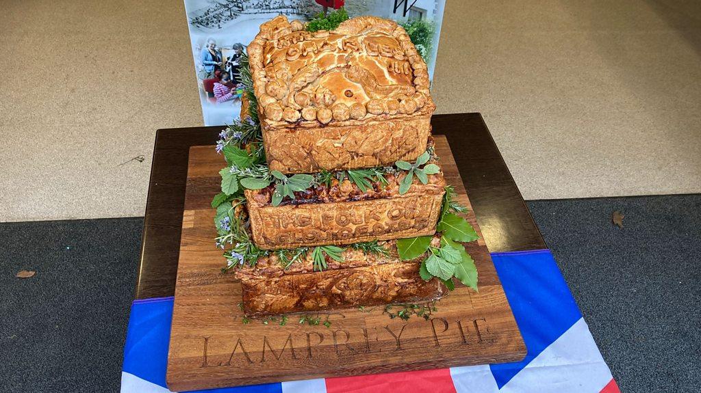 Lamprey Pie on a table with a Union Jack flag