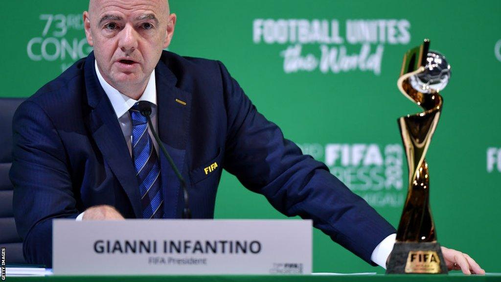 Gianni Infantino with the Women's World Cup trophy