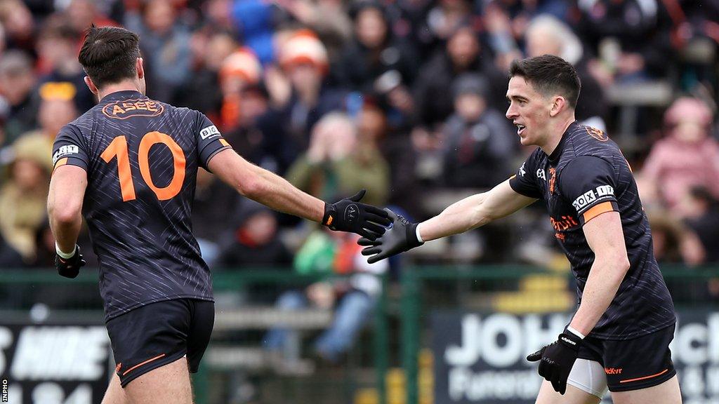 Campbell and Grugan celebrate Campbell's goal