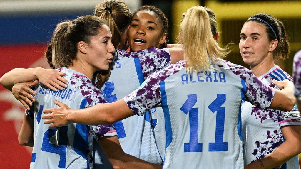 Salma Paralluelo (C) celebrates scoring her team's first goal with teammates