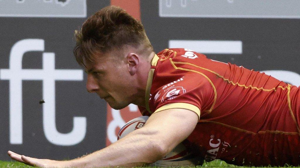 Catalans Dragons winger Tom Davies scoring a try