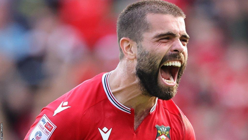 Midfielder Elliot Lee celebrates after scoring for Wrexham