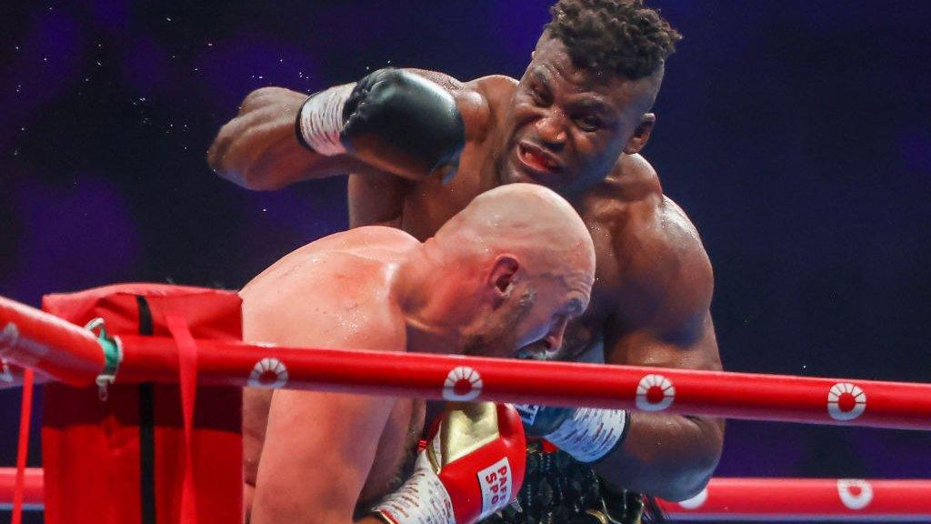 Francis Ngannou punches Tyson Fury