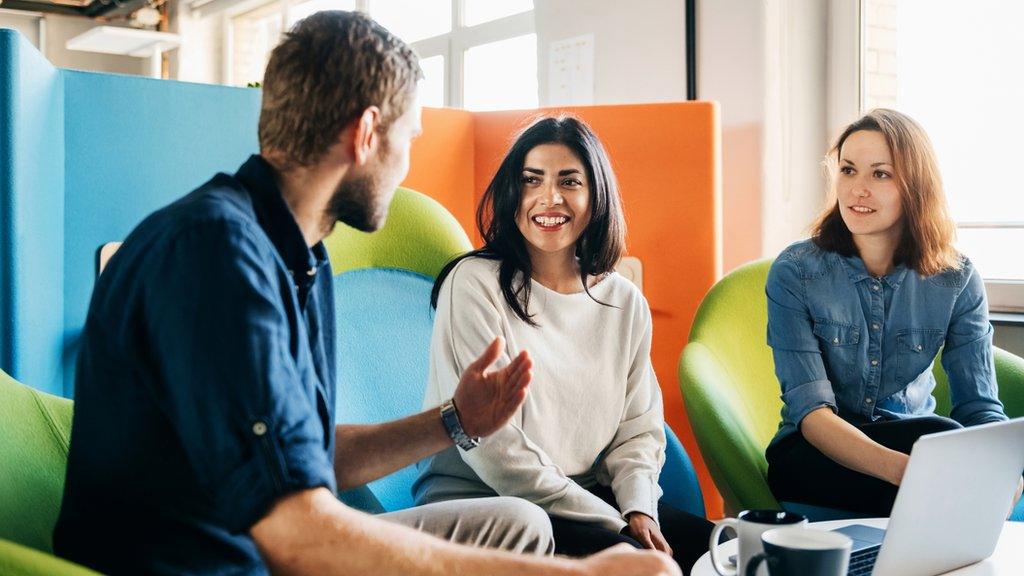 People sat talking in an office