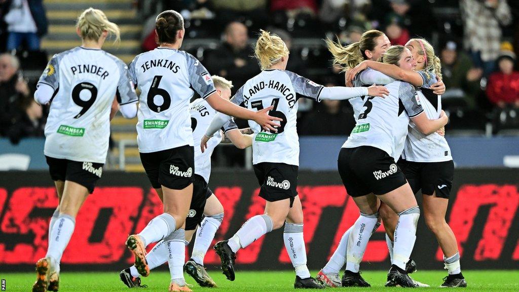 Swansea players celebrate Ellie Lake's equaliser