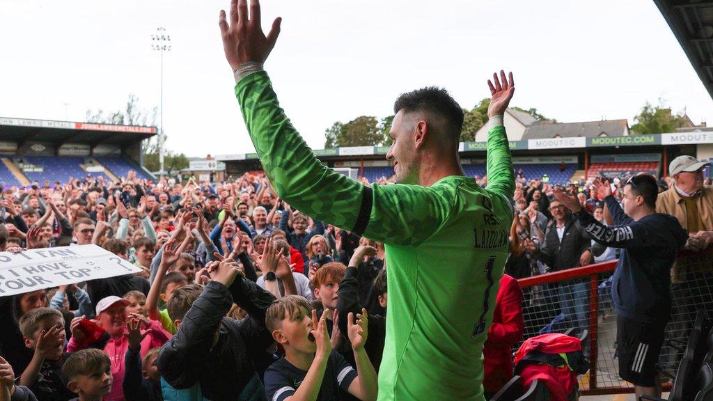 Goalkeeper Ross Laidlaw celebrates Ross County's Premiership survival with fans