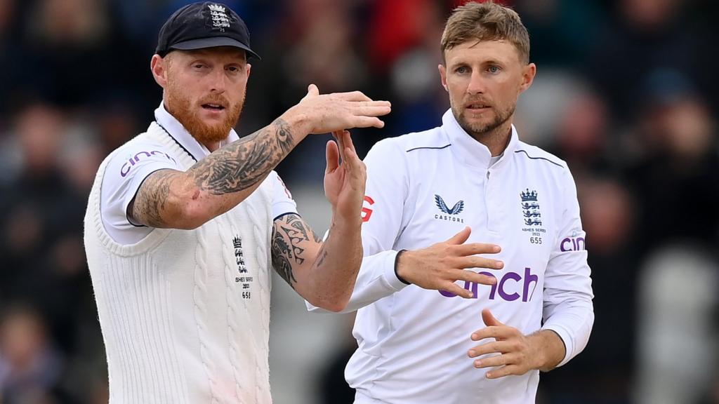 England captain Ben Stokes (left) signals for a review while stood next to Joe Root (right)