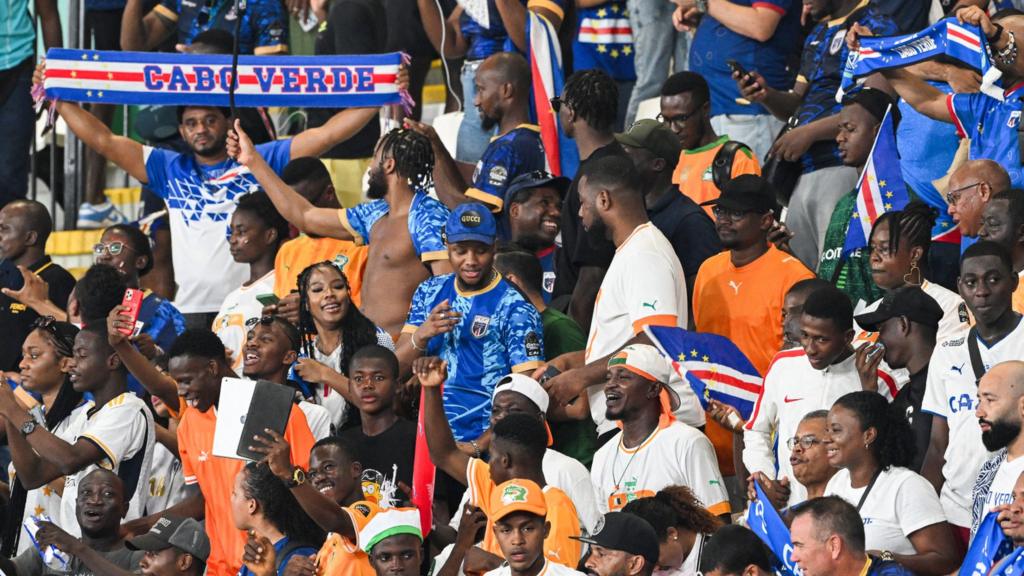 Cape Verde's supporters in the stands waving scarfs and banners