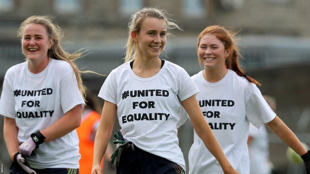 Players wear #UnitedForEquality t-shirts before the game in Navan