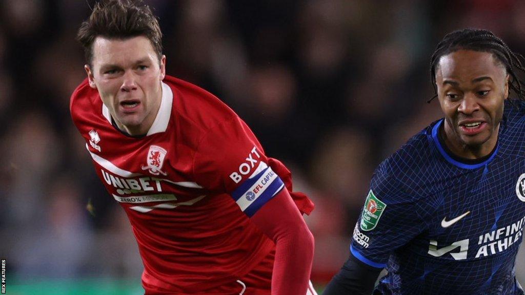 Middlesbrough captain Jonny Howson runs with Raheem Sterling