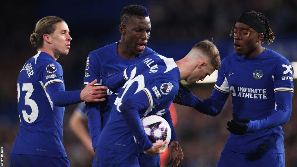 Chelsea players argue over who will take a penalty