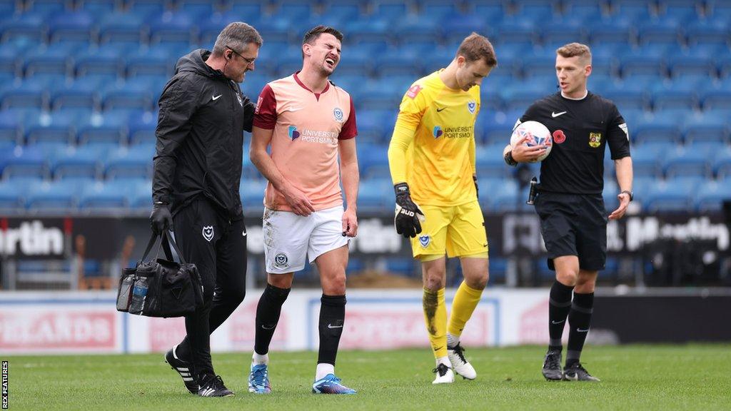 Regan Poole leaves the field injured