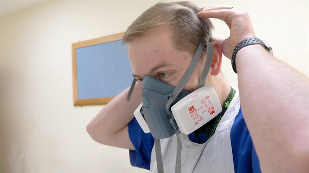 Doctor with mask over mouth