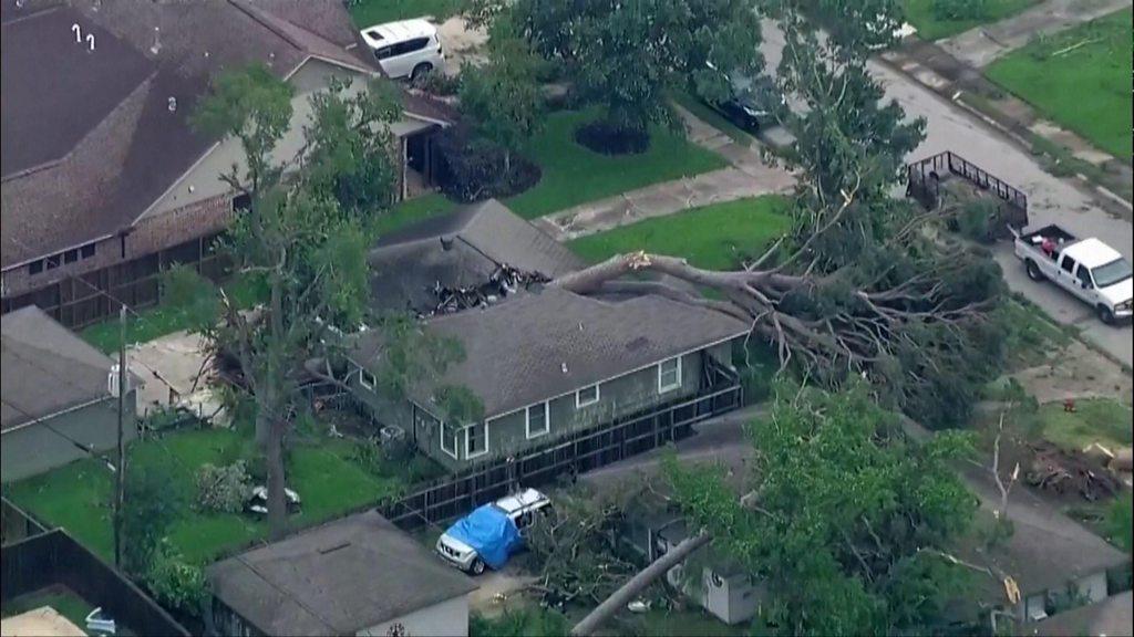 Fallen tree lies on house in Texas