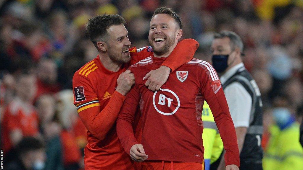 Aaron Ramsey and Chris Gunter laughing