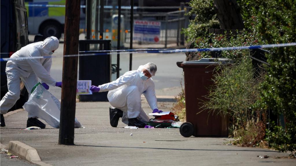 Police forensic scientists gather evidence in Nottingham