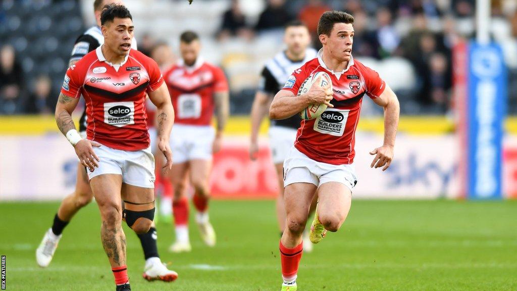 Brodie Croft runs with the ball for Salford