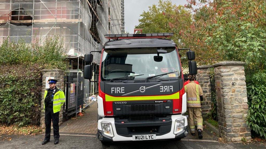 A fire engine and police on Aiken Street