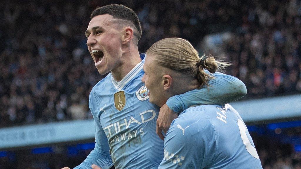 Phil Foden and Erling Haaland celebrate