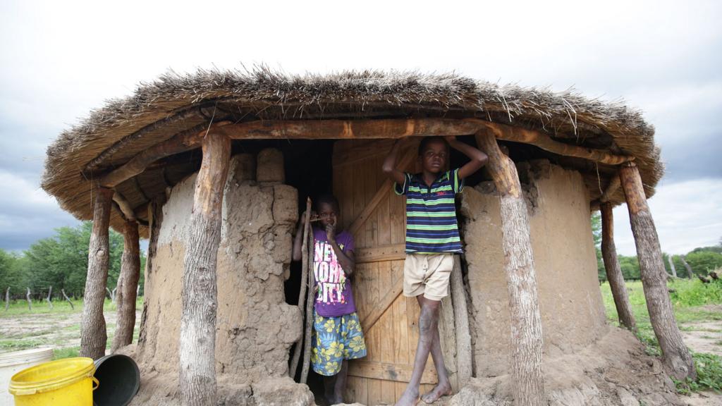 Children outside a rondavel in Zimbabwe - 2017