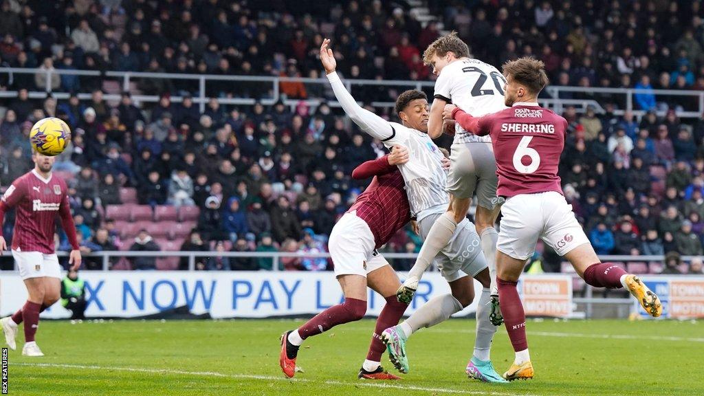 Sean Raggett scores for Portsmouth with a thumping header