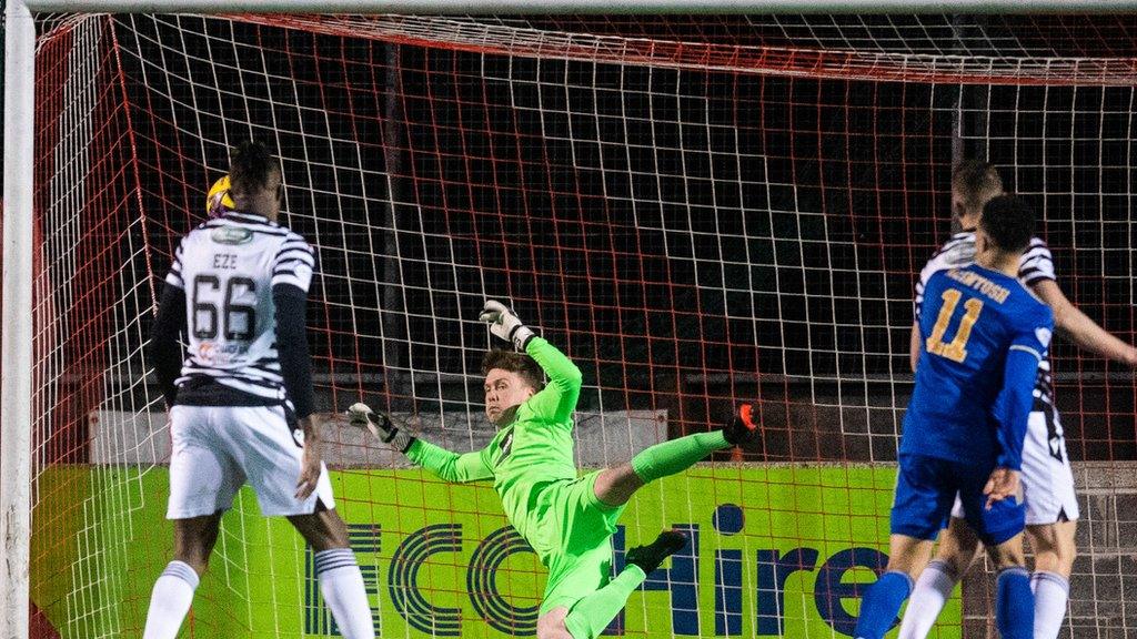 Cove's Leighton McIntosh is denied by the crossbar