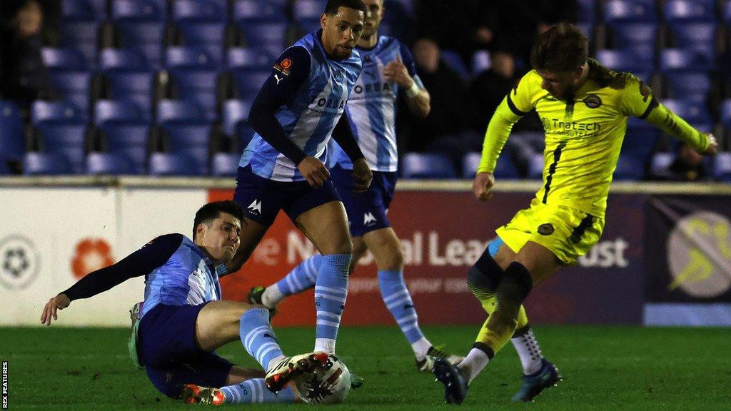 Action from Farnborough v Torquay United