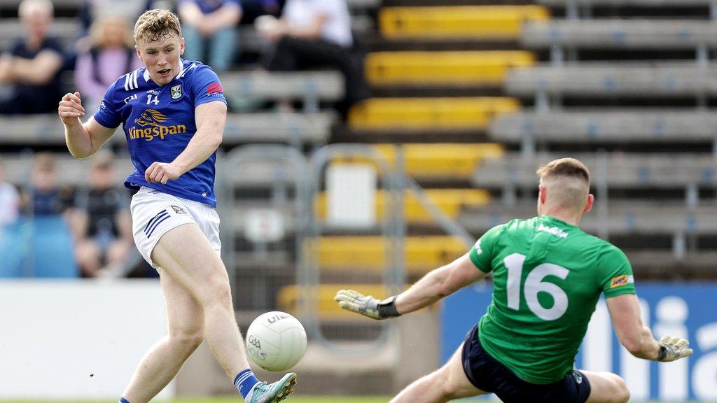 Cavan's Paddy Lynch's shot at goal is saved by Killian Roche