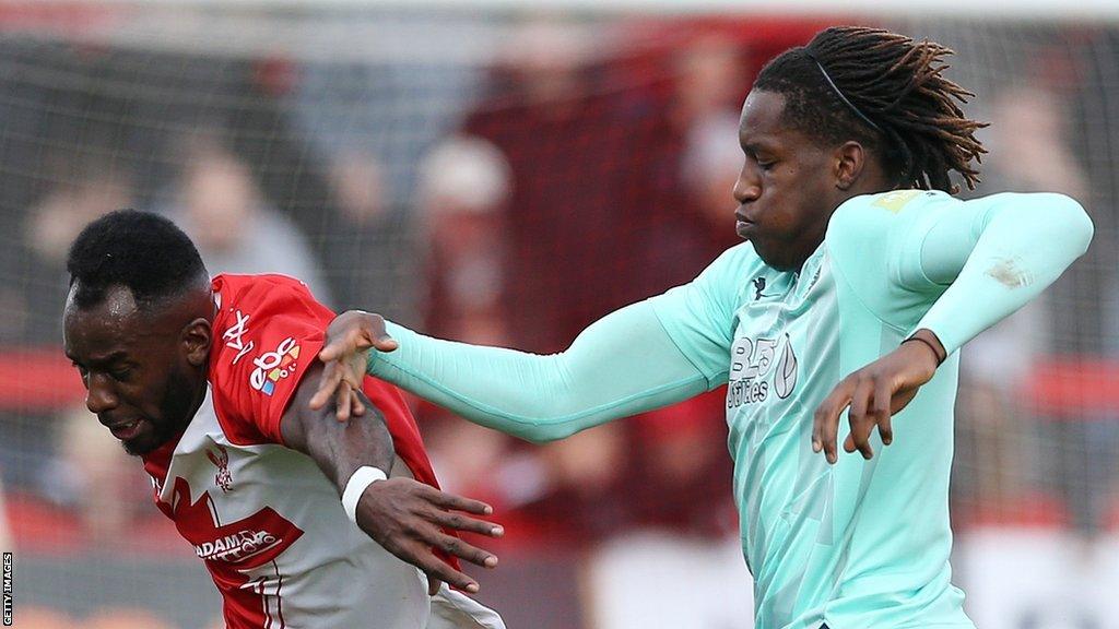 Fleetwood's Bosun Lawal (right) battles with Amari Morgan-Smith of Kidderminster