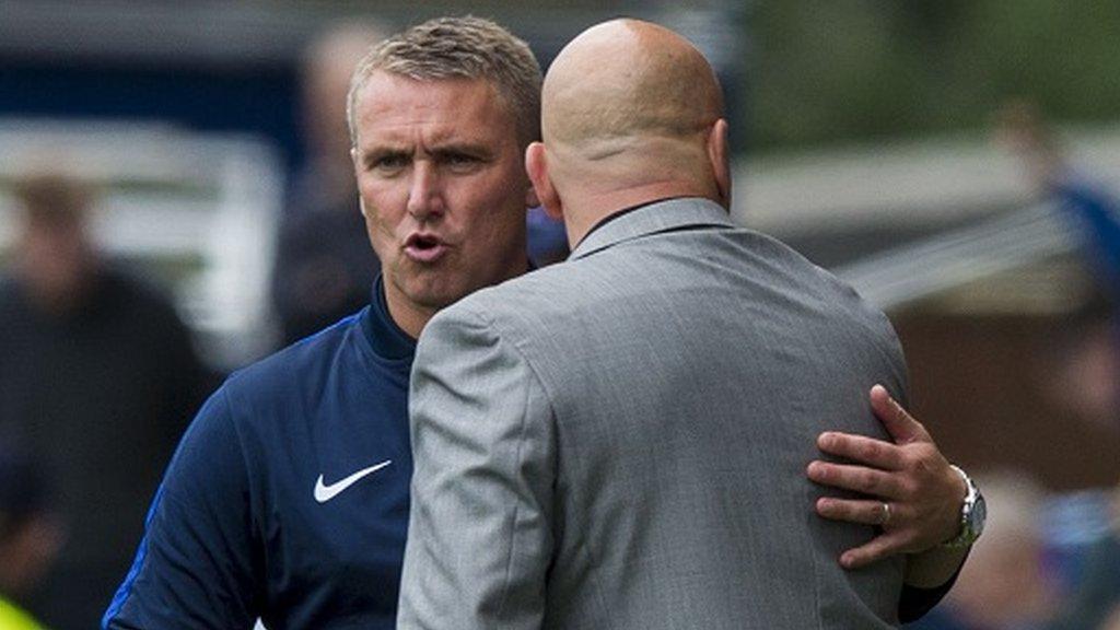 Kilmarnock boss Lee Clark embraces Morton counterpart Jim Duffy