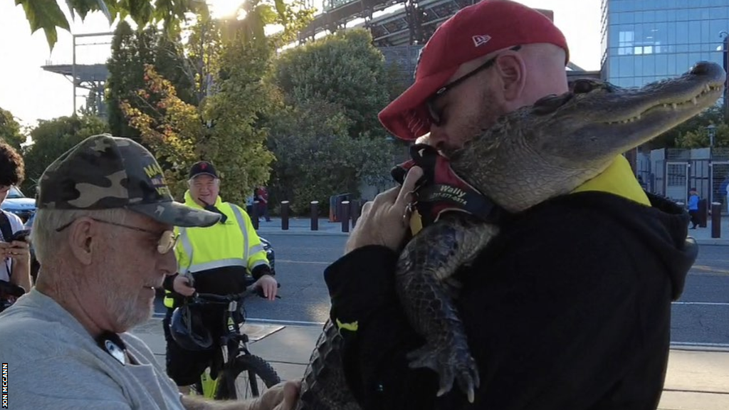 Wally the Alligator being held