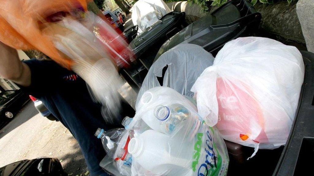 Waste being emptied into a wheelie bin