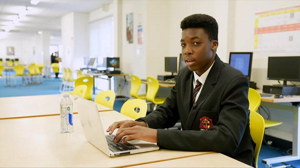 School reporter Ben at his laptop