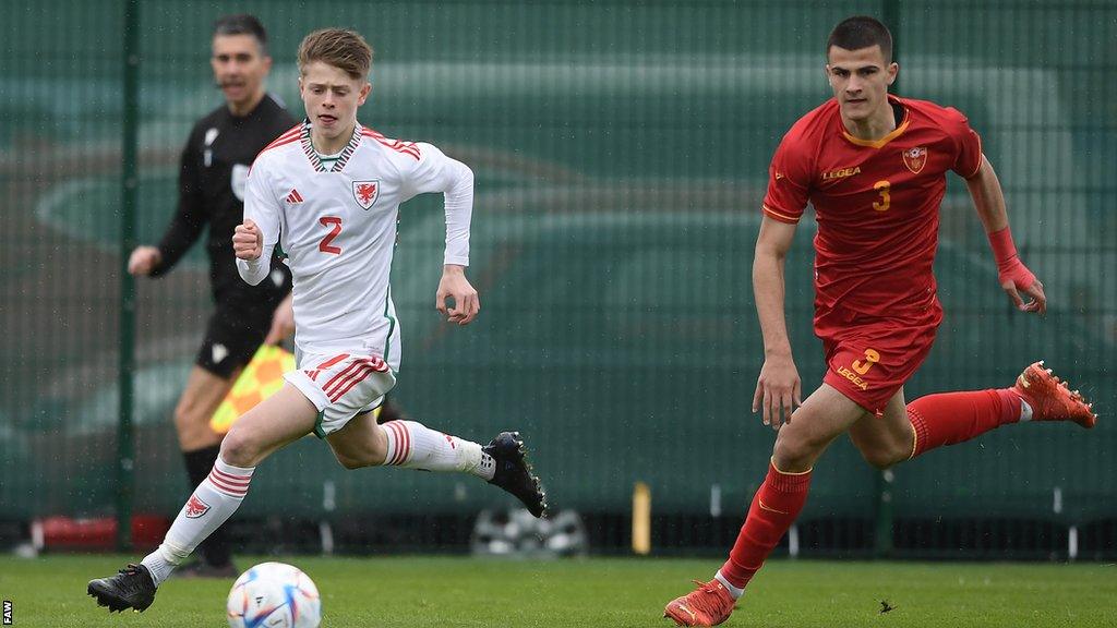 Rhys Thomas in action for Wales against Montenegro