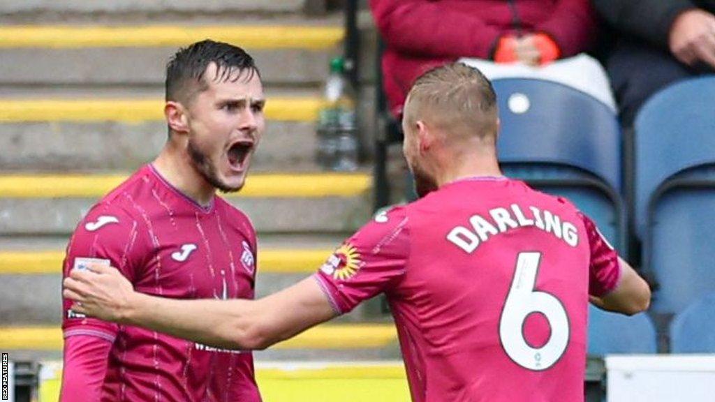 Liam Cullen (left) celebrates scoring his goal with team-mate Harry Darling