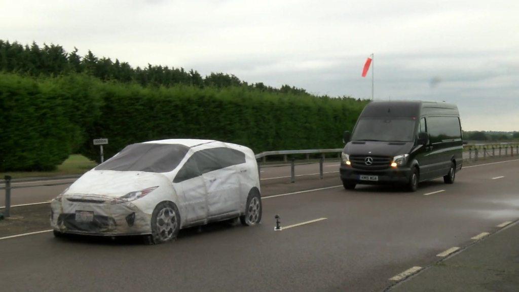 Dummy car hit by van