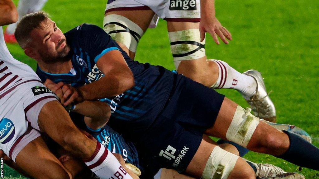 Elliott Stooke makes a tackle for Montpellier