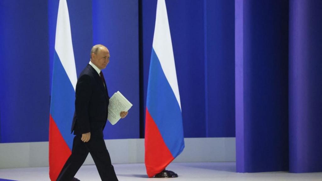 Putin walking past Russian flags