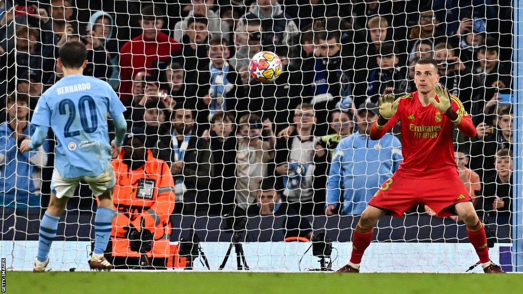 Andriy Lunin saves Bernardo Silva's penalty.