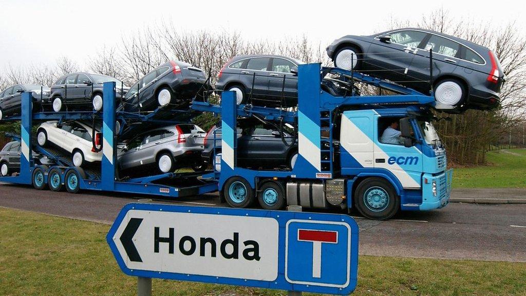 A transporter loaded with Honda cars leaves the Swindon factory on January 30, 2009.