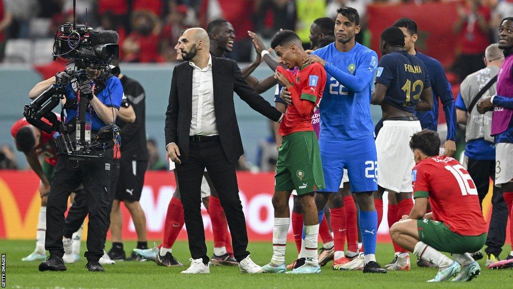 Walid Regragui (left) consoles his Morocco team