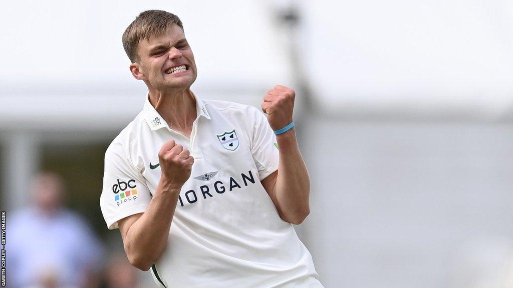 Ben Gibbon celebrates taking a wicket for Worcestershire